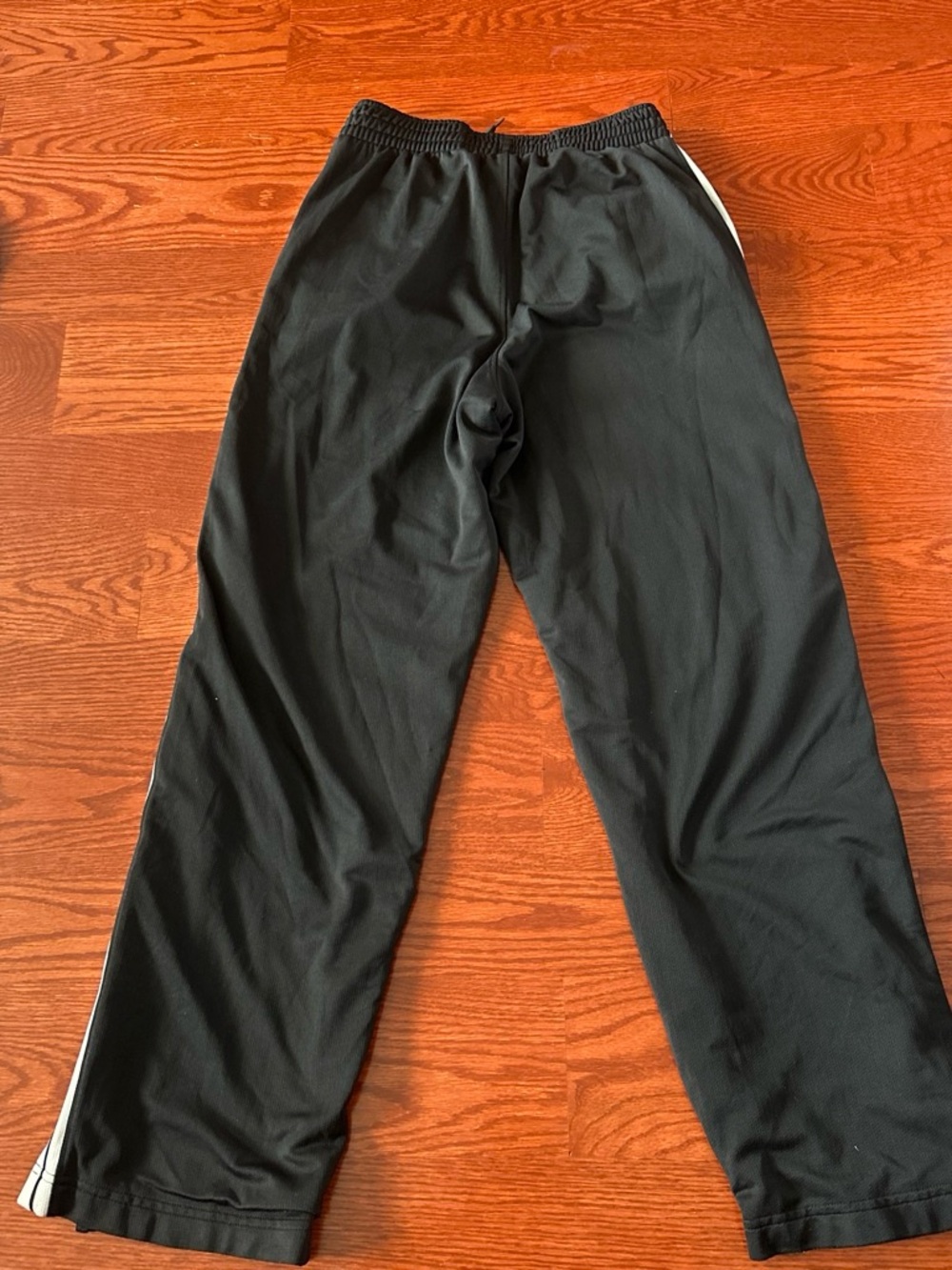 Black Nike Track Pants with White Side Stripes